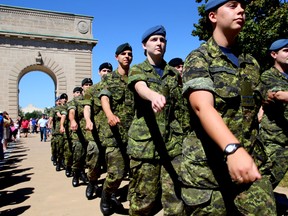 Royal Military College first-year cadets and transfers from College Militaire Royal in St. Jean Sur Richelieu, Que., march under the Memorial Arch at RMC on Saturday. They won’t march under the arch again until graduation. (Ian MacAlpine The Whig-Standard)