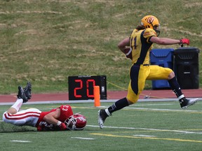Queen's Golden Gaels Giovanni Aprile marches in for one of four touchdowns on the day versus the York Lions on Sunday. The Gaels opened their OUA football season with a convincing 52-1 win. (Dave Thomas QMI Agency)