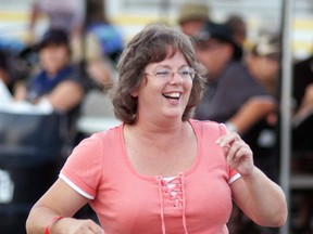 Wendy Salisbury dances to the music with friends, during the Wallaceburg Kinsmen Ribfest on Saturday. The three-day event was held at the Wallaceburg Kinsmen Community Centre. (DAVID GOUGH, QMI Agency)