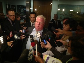 Mayor Rob Ford speaks with reporters after council's vote on Monday. (DON PEAT/Toronto Sun)
