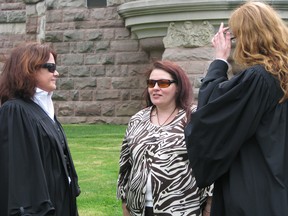 In this file photograph Mellissa Garland, centre, at the Oxford County Courthouse with defence counsel Rhonda Fawcett. left, and junior counsel Dayna Gulka. Garland is facing second degree murder charges. HEATHER RIVERS/WOODSTOCK SENTINEL-REVIEW