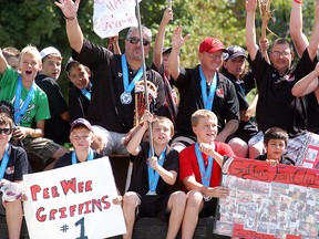 The Wallaceburg Minor Lacrosse Association's Peewee team celebrates during an impromptu parade on Murray Street on Saturday. It was an exciting day for the minor lacrosse association, as they held a parade to honour three provincial winning teams, and three players who competed at national competitions. They also held their annual year-end banquet and held the grand-opening of their new outdoor lacrosse facility at Glen Mickle Park.