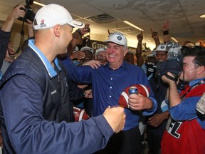 Argos coach Scott Milanovich and GM Jim Barker celebrate after the Toronto Argos won the Grey Cup last season. If Barker had been hired in Winnipeg instead of Joe Mack after the 2009 season, the Bombers' on-field future may have been far brighter than it is today. (Craig Robertson/QMI Agency file photo)