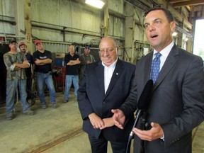 Workers at Kel-Gor Limited in Sarnia listen as PC leader Tim Hudak talked about his party's plan to attract manufacturing jobs to Ontario. Hudak  and Sarnia-Lambton MPP Bob Bailey, left, toured the industrial plant on Plank Road and spoke to reporters Tuesday. (CATHY DOBSON, The Observer)