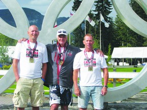 (L-R): Dave Foley, John Swaine and John Ferg, all of Portage la Prairie, finished the 2013 IRONMAN triathlon in Whistler, B.C., on Aug.25. (Submitted photo).