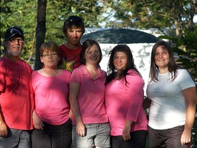 The Dion family and friends held their 10th annual fundraiser with a pig roast and entertainment in Becher on Saturday. Proceeds go to the Canadian Breast Cancer Foundation. The family includes, from left, Guy Dion, Bev Dion, Mitchell VanDamme, Charlotte Hogan, Ali Dion and Emily VanDamme.
