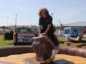Miriam Hutchinson, one of the Ag. Society Director's, tried her hand at the bucking bronco.