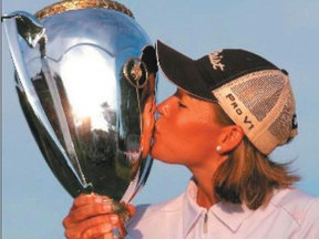 Katherine Hull kisses the trophy after winning the CN Canadian Women's Open at the Ottawa Hunt and Golf Club in 2008. (Darren Calabrese, QMI Agency file)