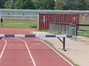 The track at St. Pats sits empty on Aug 28, 2013. With the school closing in 2014, there is some confusion with what will be done to the track. Sarnia Central Athletics has requested a field house be built to replace the storage bins pictured here. SHAUN BISSON/THE OBSERVER/QMI AGENCY