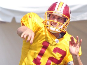 With Robert Griffin II sidelined with injury, Washington Redskins backup quarterback Kirk Cousins took first-team reps during training camp this summer. (JOHN KRYK/QMI Agency)