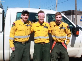 Jenniffer Hill stands with two other Helitack firefighters, Andrew Cudney and Ryan McLachrie. Their teams are based in Swan Hills and work out of the Whitecourt ESRD office.
Celia Ste Croix | Whitecourt Star