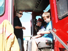 Firefighter Taya Green shows Jorja Amiot, 6, Ashton Zimmer, 9, and Pearson Amiot, 9, around the fire truck at the Whitecourt Early Learning Market and Barbeque on Saturday, Aug 17.
Celia Ste Croix | Whitecourt Star