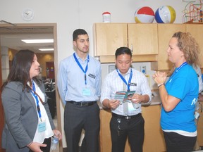 Western University medical students left, Helene Baldwin, Mouhanned El-Youssef and James Wei discuss topics with Krista Bodkin of the West Elgin Community Health Centre during a tour Thursday in West Lorne.