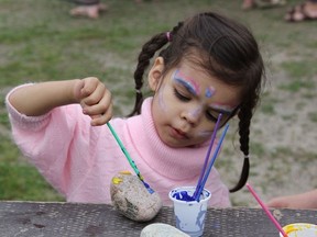 Elianna Chum turned three on Monday so she celebrated her birthday at the NEOFACS picnic getting her face painted, painting rocks and bouncing in the castles.