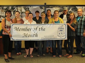 Detour Gold employees at the Cochrane office gladly accept the “Member of the Month” banner from the Board of Trade's Director, Chantal Paquette (far left).