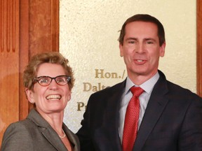 Premier Kathleen Wynne meets with her predecessor, Dalton McGuinty, outside the premier's office two days after her election as Liberal leader.