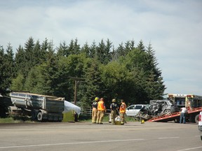 A photo of the Aug. 22 collision between a gravel truck and a small car at the intersection of 627 and 770. The crash killed two people, but area residents say not enough is being done by Alberta Transportation in the wake of this tragedy. - April Hudson, Reporter/Examiner