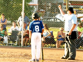 A Saskatoon hitter looks on in disbelief as the home plate umpire calls a teammate who had just scored a run on the front end of a grand slam home run out for failing to touch the plate, while White Sox catcher Joey Whalen celebrates with a fist pump. The four-run shot became almost null and void with the call, as only one run counted and with the out being the third of the inning and the final one of the game, the Sox posted a 7-5 win in a most unusual way. - Gord Montgomery, Reporter/Examiner