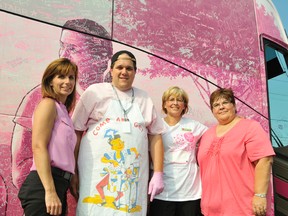 Karen Malone, left, Michael Bellmore of Shoppers Home Health Care, and Nicole Sloan and Diane Dygos of CIBC during the Pink Tour stop in New Sudbury on Thursday.