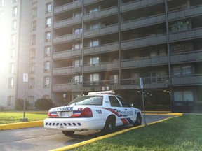 Toronto Police remain at an Etobicoke highrise after a 12-year-old boy was critically hurt in an apparent domestic-related incident overnight. (CHRIS DOUCETTE/Toronto Sun)