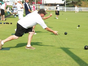 Rick Wood, of Seaforth, tosses his bowl during the first game of the Art and Mary Finlayson Memorial Anniverary tournament, which attracts a full green with 36 teams in attendance.