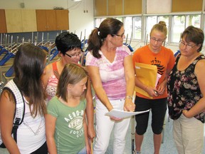 Grade 8 English and Science teacher, Mary Wilkinson (centre), is seen here talking with some of her new students and their family members during an orientation day at MDHS last Tuesday. From left are Savanah Cook, Brianna Cook, Esther McCue, Myah Vingerhoeds and Amy Vingerhoeds.