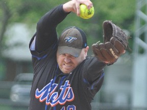 Steve Cook of the Mitchell Mets delivers a pitch during South Perth Men's Fastball League action this season. Cook was the hard-luck losing pitcher in Game 2 of their Breslau series, 3-1.