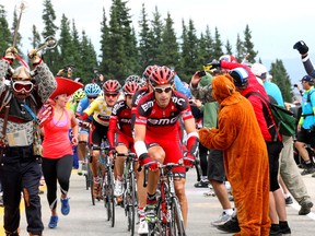 Racers are seen racing past throngs of fans, many dressed in costumes through Hoosier Pass during stage 5 of the 2012 USA Pro Challenge. After Hoosier Pass, it was a downhill ride to Colorado Springs.  Photo credit: John Pierce/PhotoSport International