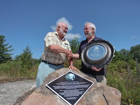 Lennox & Addington County Warden Doug Bearance presents long-time area resident and internationally acclaimed astronomer Terence Dickinson with an L&A County Award for Lifetime Achievement.