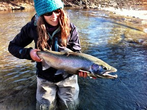 Ashley Rae with a steelhead (rainbow trout) caught and released in a Lake Ontario tributary. (supplied photo)