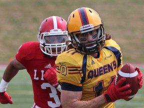 Giovanni April of the Queen’s Golden Gaels scores one of his four touchdowns during a 52-1 victory over the York Lions in Ontario University Athletics football action at Centennial Park in Toronto on Aug. 25. The Gaels host McMaster at Richardson Stadium Monday. (Dave Thomas/QMI Agency)