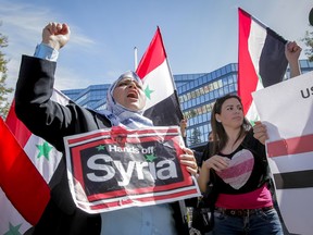 Syrian native Fatima Albarri chants for peace in her home country during a rally in downtown Calgary, Alta. on Saturday, Aug. 31, 2013. Protestors were calling for no U.S. military action in Syria, the same day U.S. President Barack Obama said he would seek congressional permission to take action against Syria. Lyle Aspinall/Calgary Sun/QMI Agency