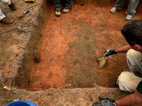 A team of anthropologists from the University of South Florida are exhuming suspected graves at the Boot Hill cemetery at the now closed Arthur G. Dozier School for Boys in Marianna, Fla., on August 31, 2013. (REUTERS/Edmund D Fountain/Pool)