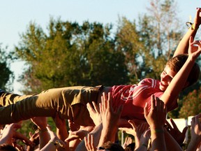 Helping hands. A concert goer is held above the crowd as she crowd surfs during Weezer's set at Sonic Boom 2013 held at Edmonton Northlands on Sunday, Sept. 1, 2013. The two day indie band festival saw huge and happy crowds, 13,000 on Saturday and 14,000 people on Sunday. Tom Braid/Edmonton Sun/QMI Agency