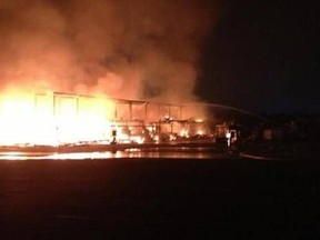 This photo from the unofficial photography website for the fire departments in the Region of Waterloo shows the St. Jacobs market building on fire Monday Sept. 2, 2013 in St. Jacobs, Ont. (@waterloofire/Twitter)