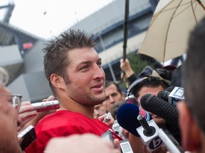 Quarterback Tim Tebow talks to the media as the New England Patriots open their training camp in Foxboro, Massachusetts, in this July 26, 2013, file photo. (REUTERS)
