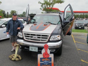 Brian Beatty, co-organizer of the inaugural Limestone Car Classic show held Saturday on Centennial Drive near Hwy. 401, stands beside his prized “Super Snake” truck. And, yes, that is not a real snake. (PETER HENDRA The Whig-Standard)