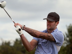 New goaltender Jonathan Bernier tees off during the annual Leafs and Legends Charity Golf Classic at RattleSnake Point Golf Club in Milton on Tuesday. (Dave Abel/Toronto Sun)