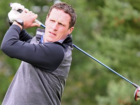 Leafs captain Dion Phaneuf watches his drive during the team's annual charity classic, held yesterday at RattleSnake Point Golf Club in Milton. (Dave Abel/Toronto Sun)