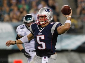 New England Patriots quarterback Tim Tebow throws a pass against the Philadelphia Eagles during the fourth quarter of their NFL preseason  game in Philadelphia, August 9, 2013. (REUTERS/Tim Shaffer)