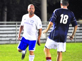 Apollo FC’s Martin Painter looks to pass player during a Middlesex Masters Soccer League game August 28, 2013. CHRIS MONTANINI\LONDONER\QMI AGENCY