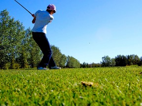 Naemi MacLeod watches her ball take flight on hole one of 18 during Monday’s Ministerial Golf Tournament aimed at raising proceeds for Fairview’s Habitat for Humanity project. DANIELE ALCINII/FAIRVIEW POST/QMI AGENCY