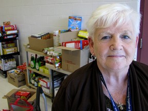 Elaine Lewis, student breakfast program co-ordinator, stands in front several cartons of food, collected and donated by Lally Kia. Chatham-Kent's school breakfast program begins on Monday, available in about 50 local schools.