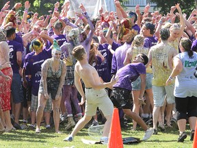 Queen's University engineering frosh take a dance break from the Thundermug Races in City Park Thursday afternoon, part of their Orientation Week activities.
Michael Lea The Whig-Standard
