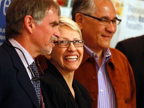 From left,  Dr. Duncan Stewart, lead principal investigator of the ENACT-AMI stem cell therapy trial, Harriet Garrow, who is part of a stem cell trial and her husband Peter Garrow during a press conference at the Ottawa Hospital General Campus September 5, 2013. (QMI Agency)