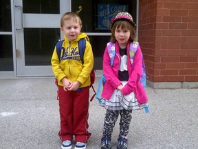 Xavier Garrett with twin sister Mackenzie, both 4, on their first day of school in September 2013. Xavier is currently in remission from a brain tumor he was diagnosed with at eight months-old. Submitted photo.