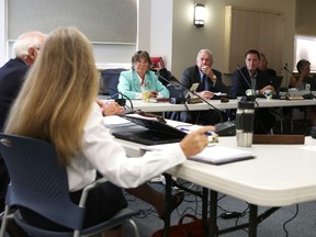 Janet Gutowski, centre, warden of Frontenac County, listens during a meeting Tuesday.
Elliot Ferguson The Whig-Standard