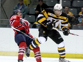 Kingston Frontenacs defenceman Loren Ulett bodychecks Oshawa Generals Jacob Busch in Ontario Hockey League exhibition play at the Rogers K-Rock Centre in Kingston.
Ian MacAlpine The Whig-Standard