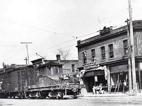 The No. 10 freight motor southbound on St. Clair Street between Grand Avenue and Dover Street. All of the background buildings still stand.