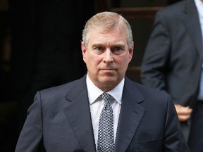 Britain's Prince Andrew leaves the King Edward VII Hospital after visiting Prince Philip in London, in this file photograph dated June 6, 2012.  REUTERS/Luke MacGregor/files